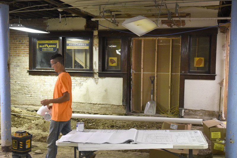 Shoe repair store front discovered under Goshen Theater